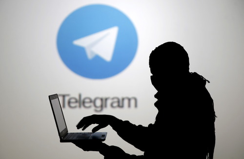 silhouette-man-lap-top-front-telegram-logo.jpg